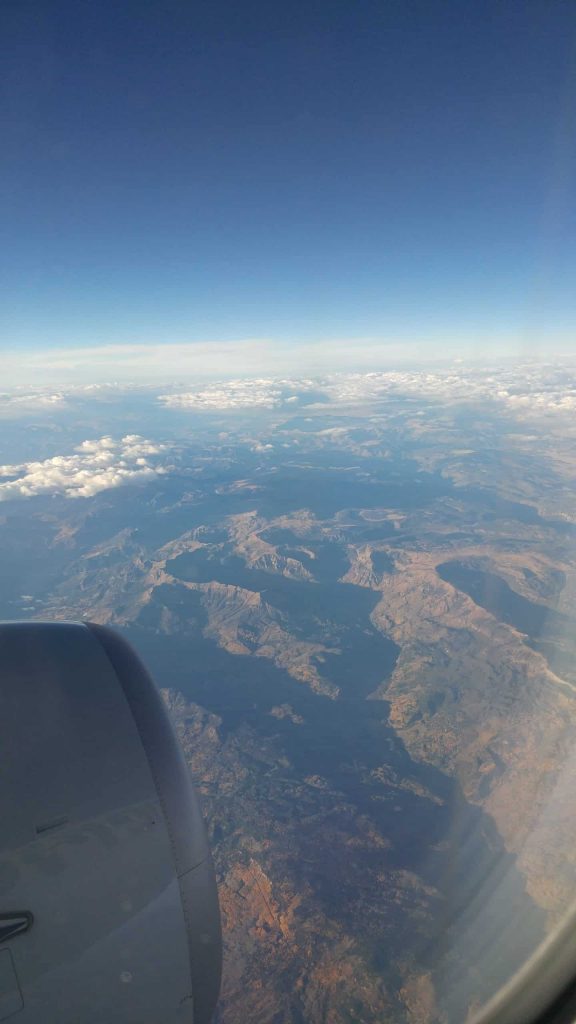 Picture from a plane window overlooking the Rock Mountains